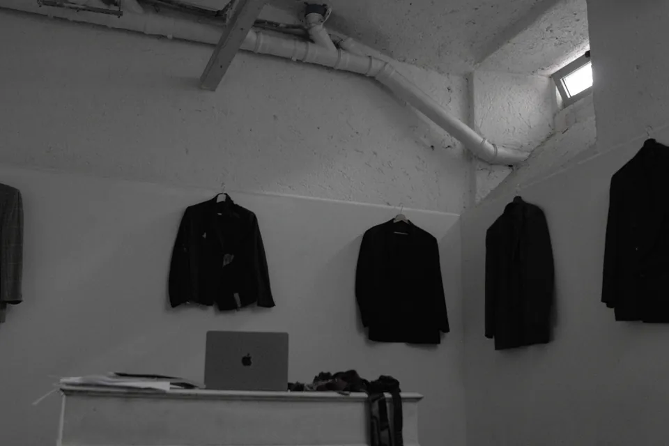 Office Monotony campaign image: dreamlike take on a workwear uniform